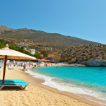 **

>Golden sandy beach, crystal clear turquoise water, Mediterranean island, Cyprus, sunny day, relaxing atmosphere, beach umbrella, distant mountains.

**